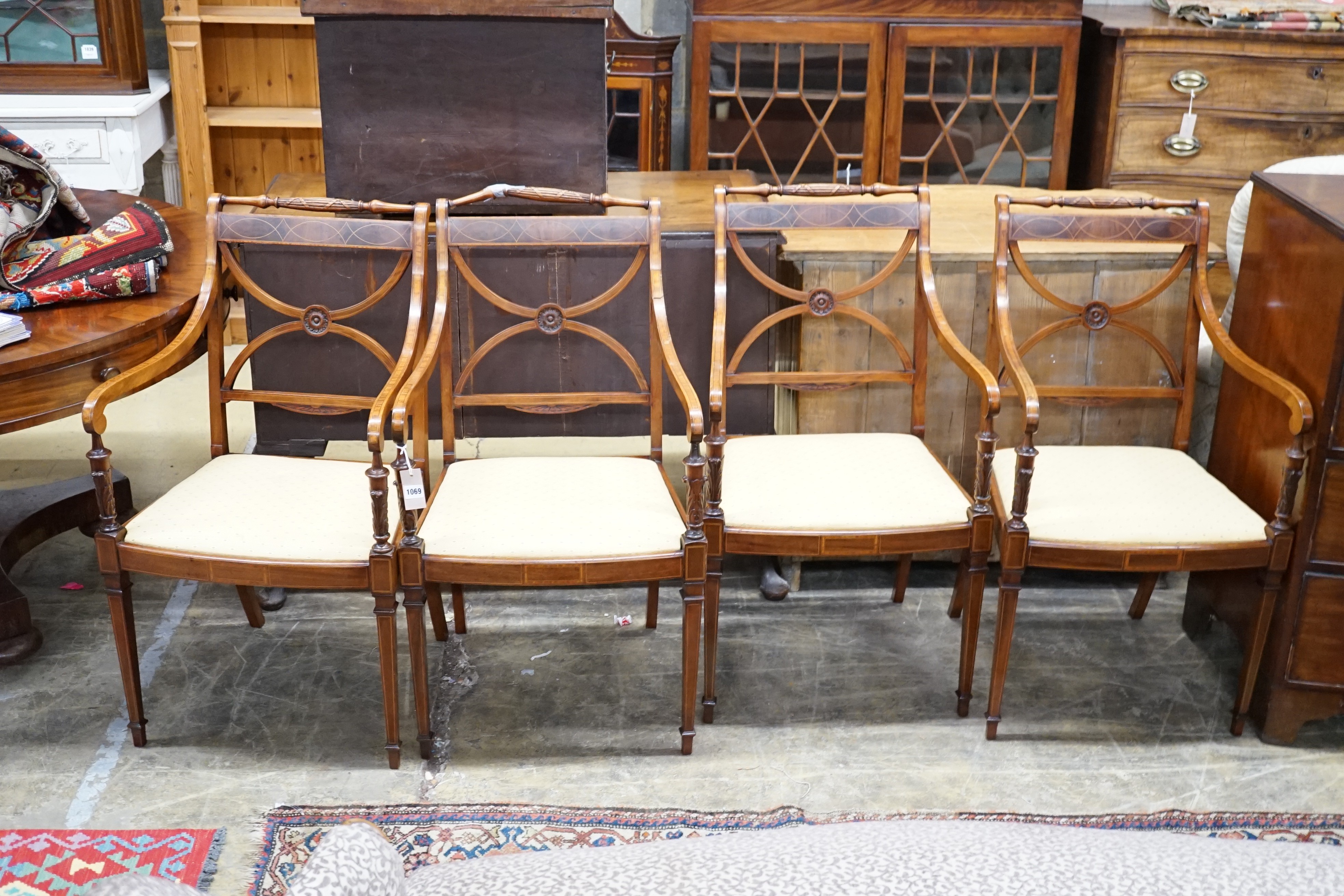 A set of four Sheraton revival inlaid mahogany salon chairs, width 52cm, height 93cm